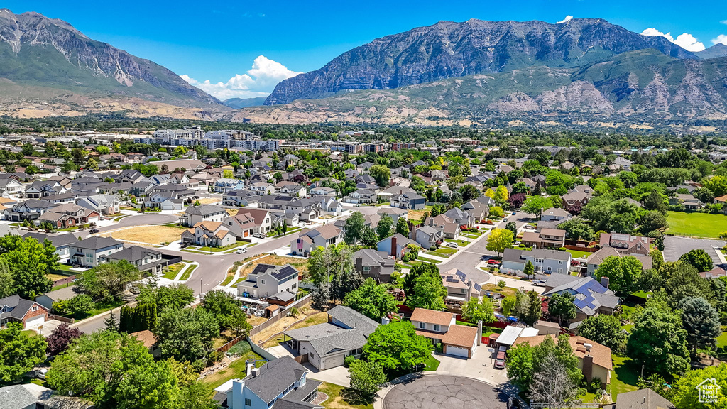 Aerial perspective of suburban area with a mountainous background