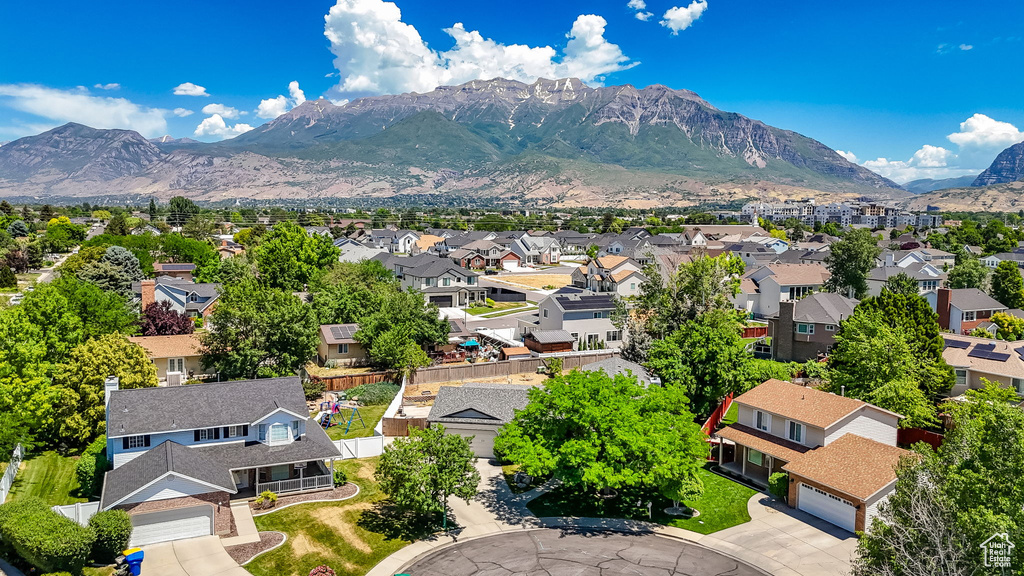 Aerial perspective of suburban area featuring a mountain backdrop