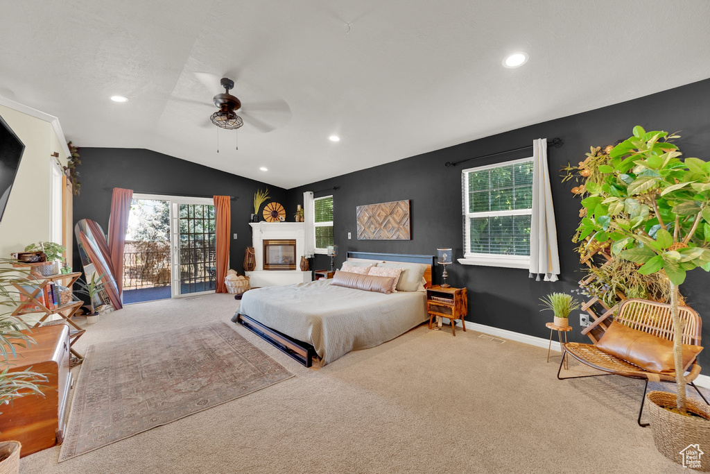Carpeted bedroom featuring lofted ceiling, recessed lighting, and ceiling fan