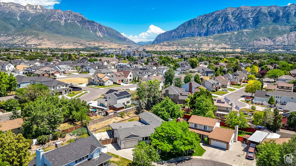 Aerial view of residential area with a mountain backdrop