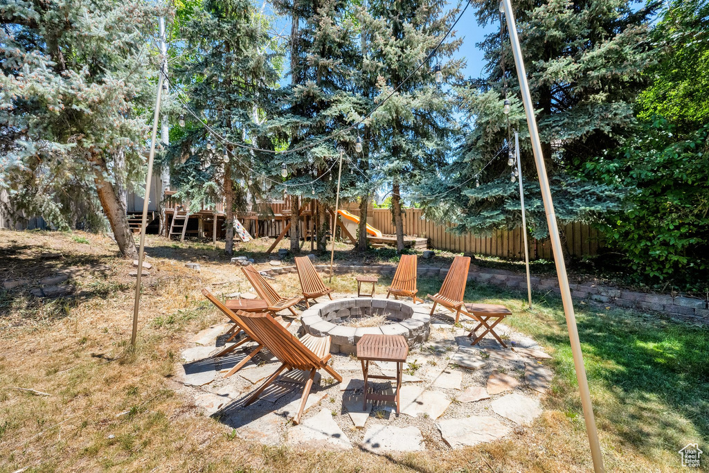 View of yard featuring an outdoor fire pit
