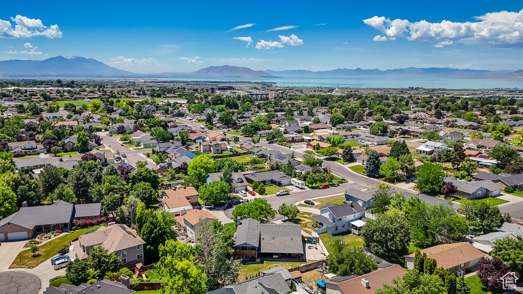 Aerial perspective of suburban area with a water and mountain view