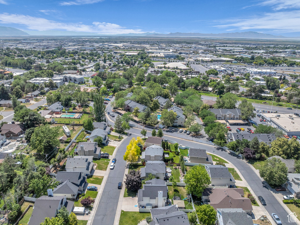 Aerial view of residential area featuring mountains