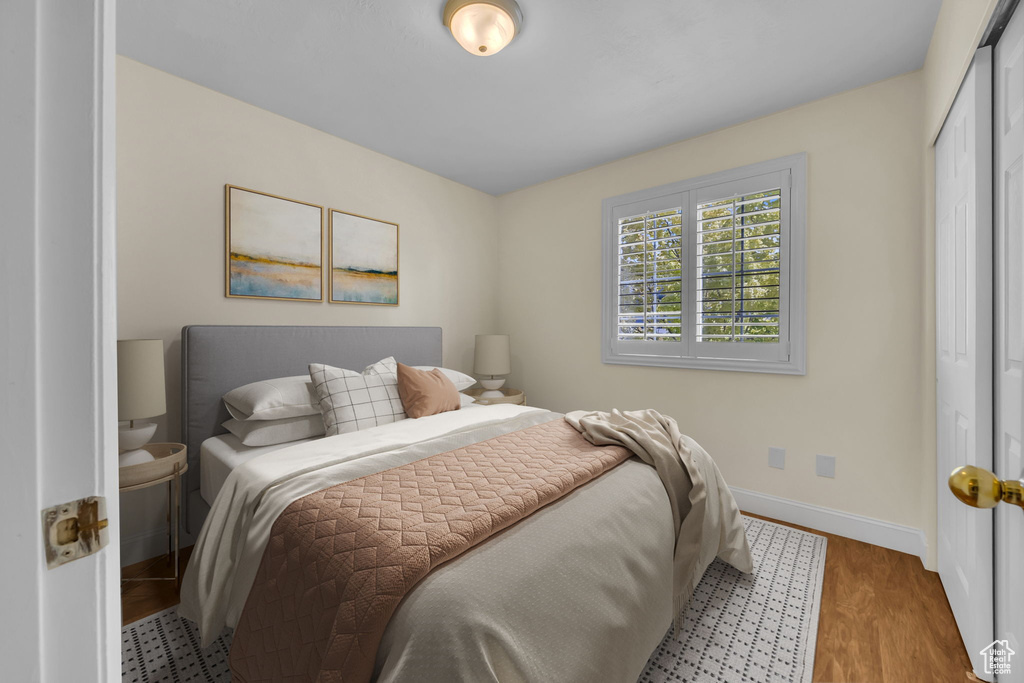 Bedroom featuring a closet and wood finished floors