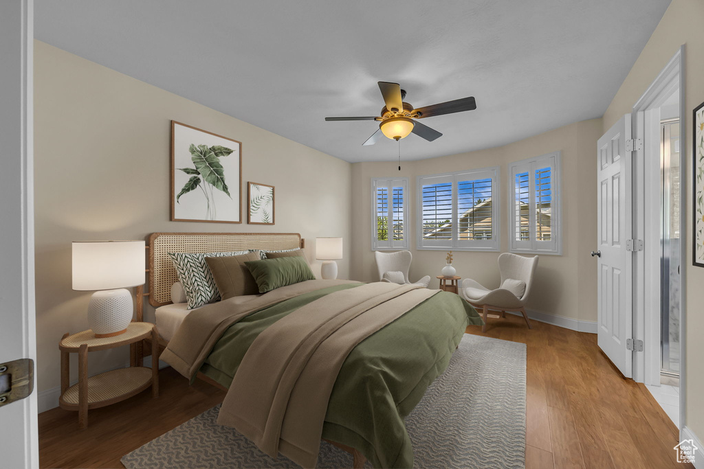 Bedroom with wood finished floors and ceiling fan