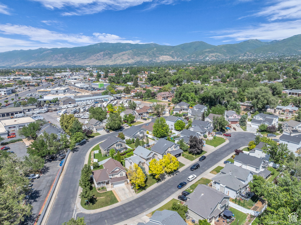Aerial perspective of suburban area featuring a mountainous background