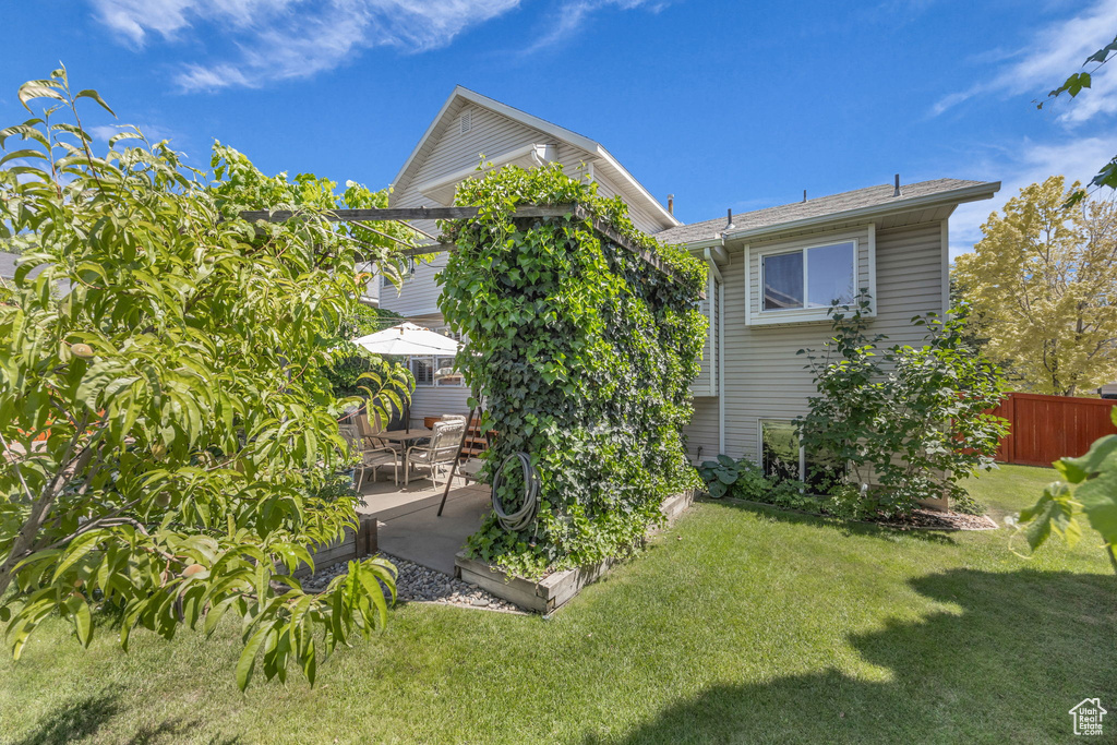 Rear view of property with a patio