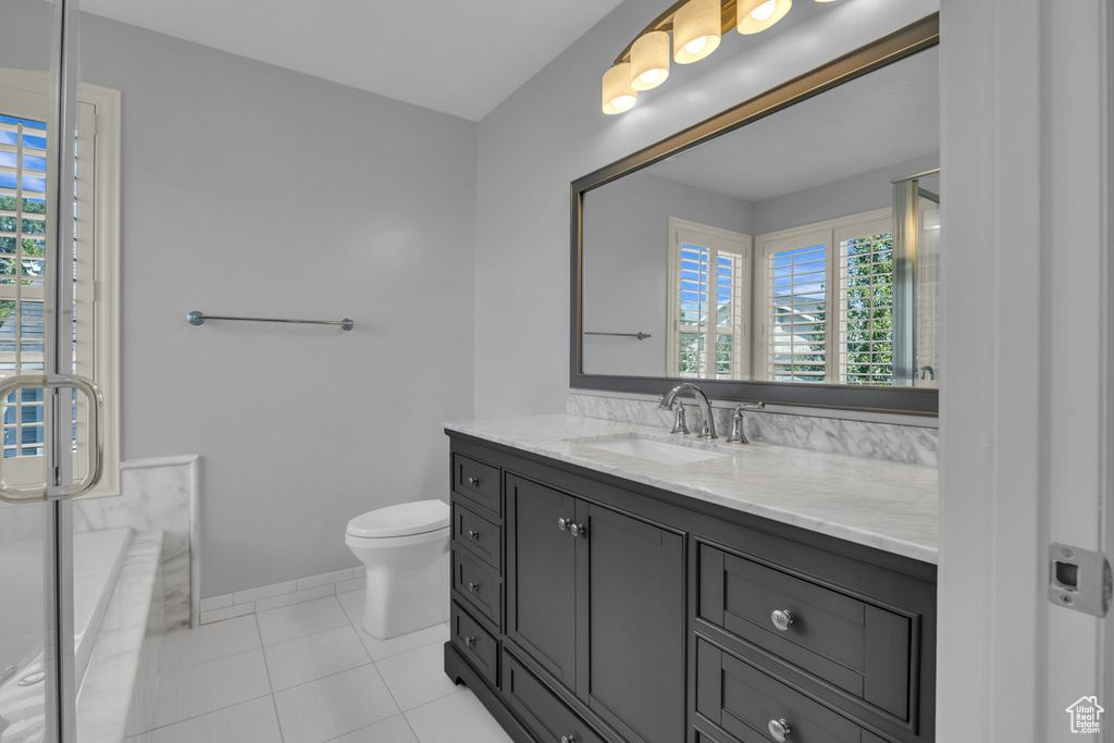 Bathroom featuring vanity and tile patterned flooring