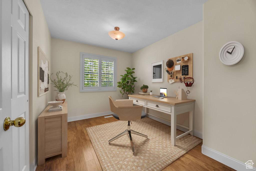 Office with wood finished floors