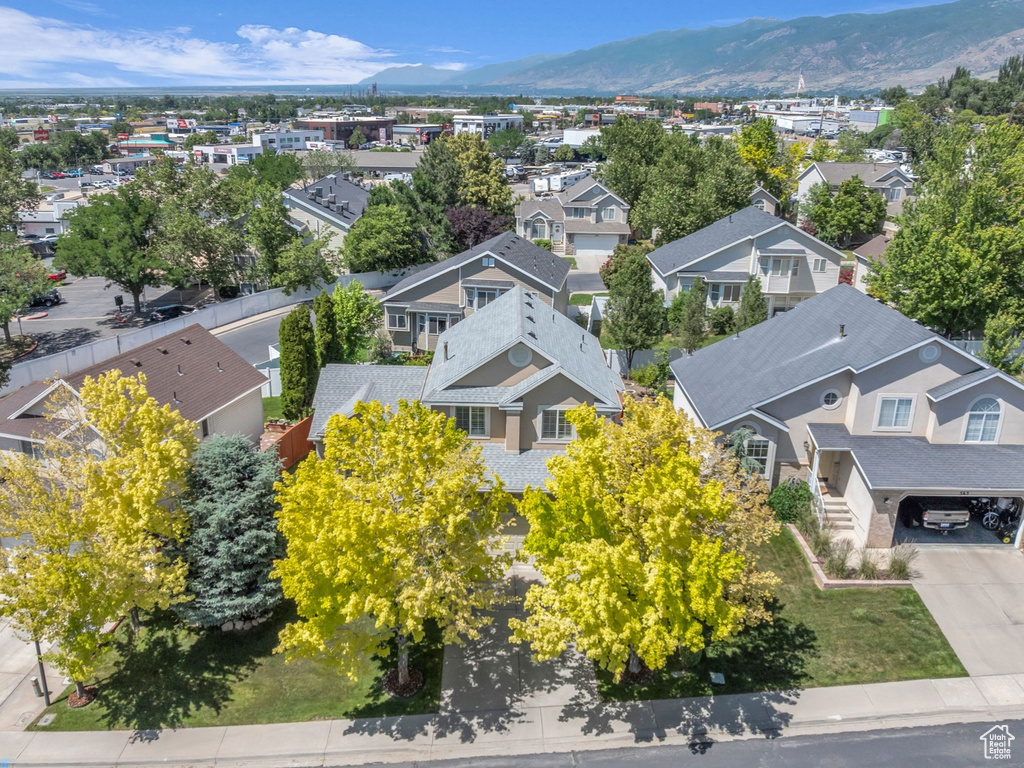Aerial perspective of suburban area featuring a mountain backdrop