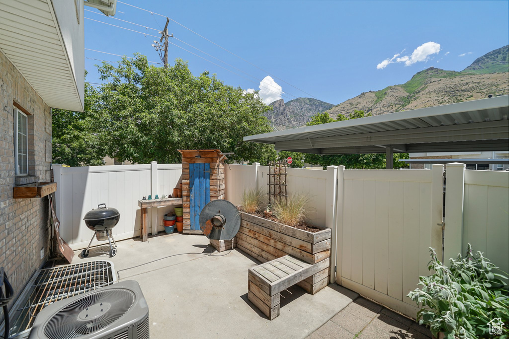 View of patio / terrace with a mountain view