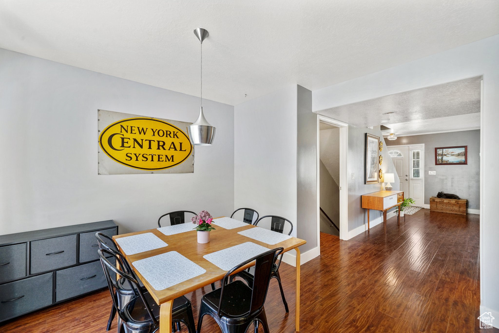 Dining room with wood finished floors and baseboards