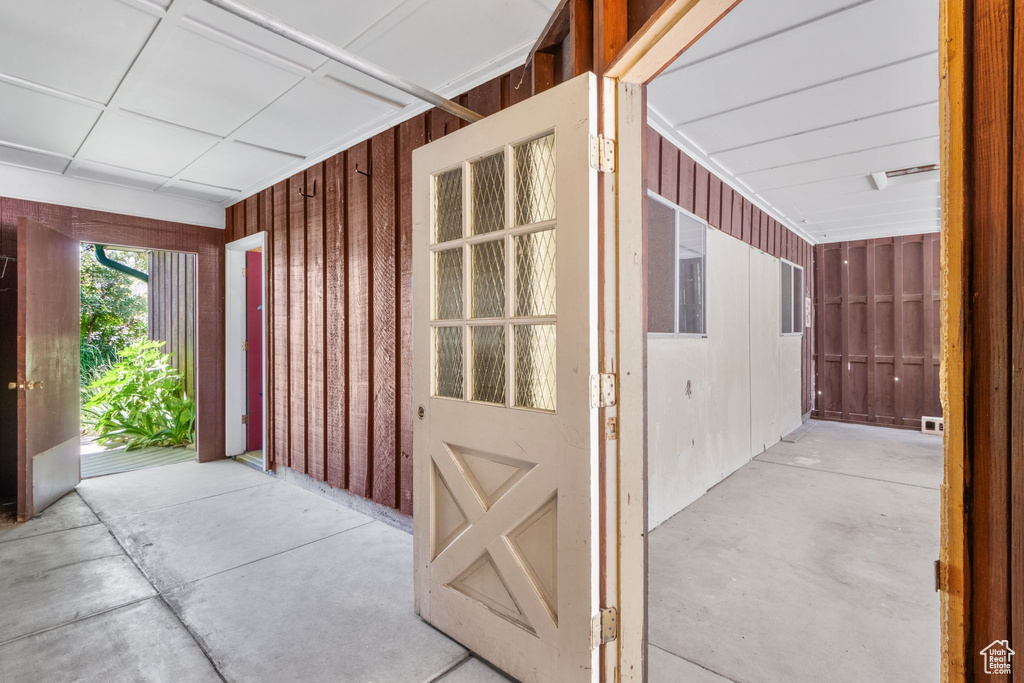 Property entrance featuring board and batten siding