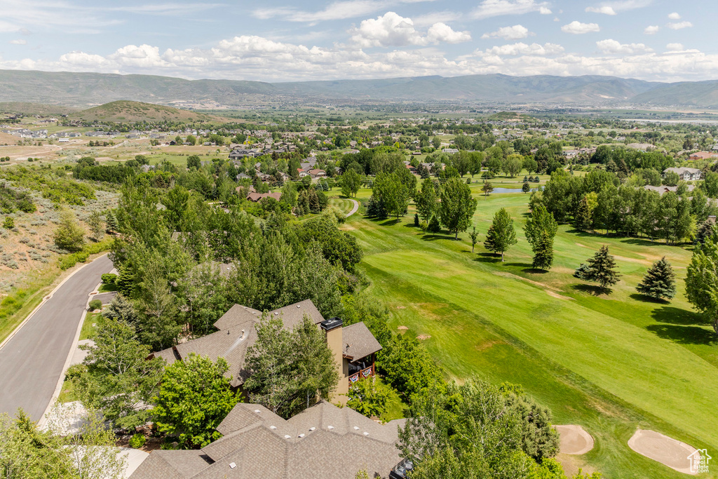Aerial view of a water and mountain view and a golf course
