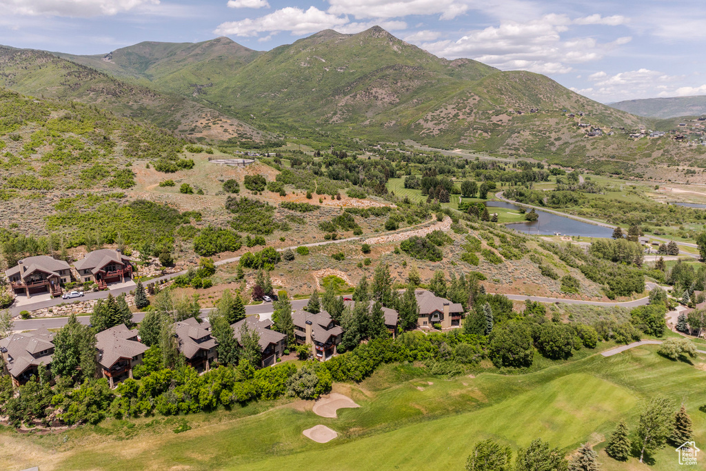 Drone / aerial view of a golf club and a water and mountain view