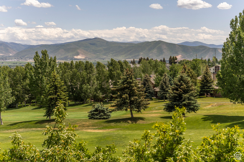 View of mountain background featuring a local golf course