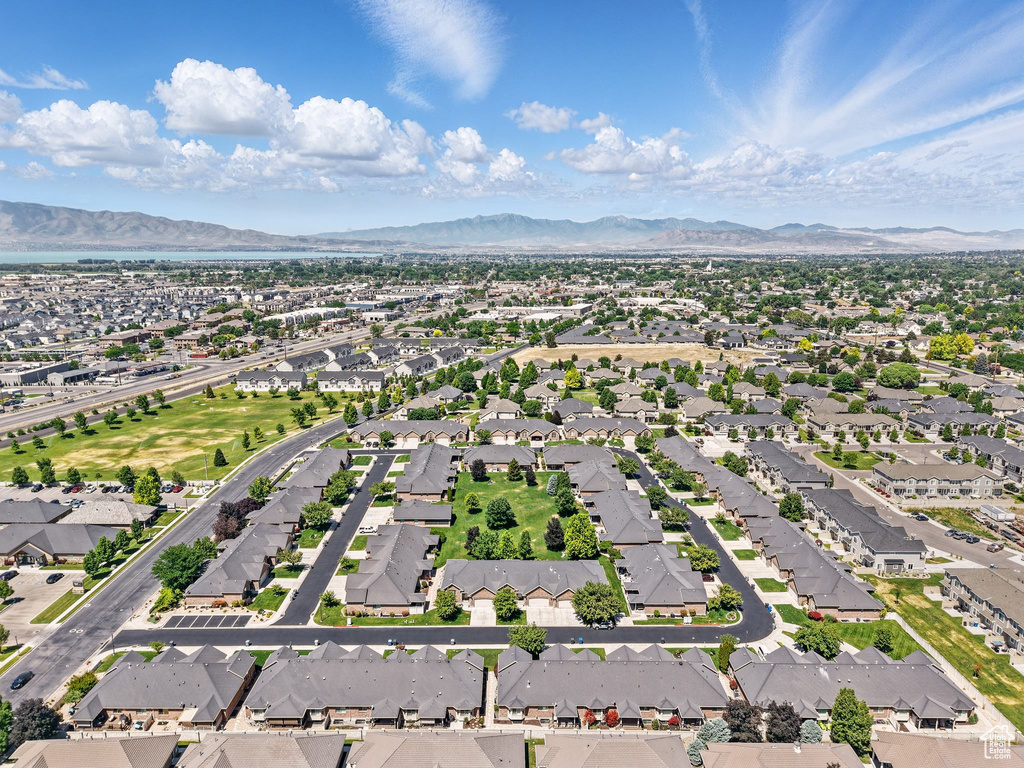 Aerial perspective of suburban area with a mountainous background