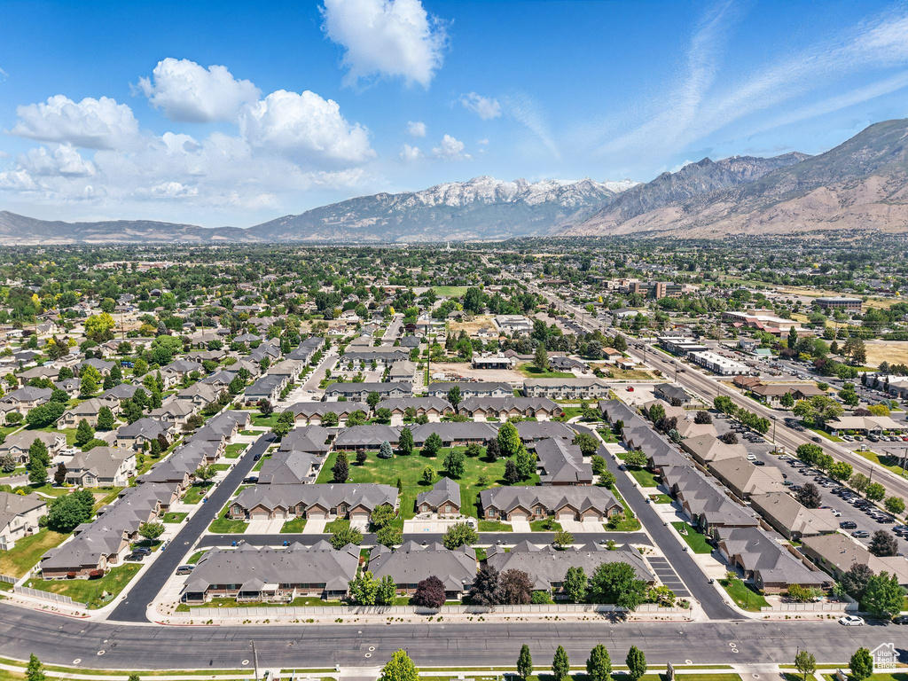 Aerial perspective of suburban area featuring a mountain backdrop