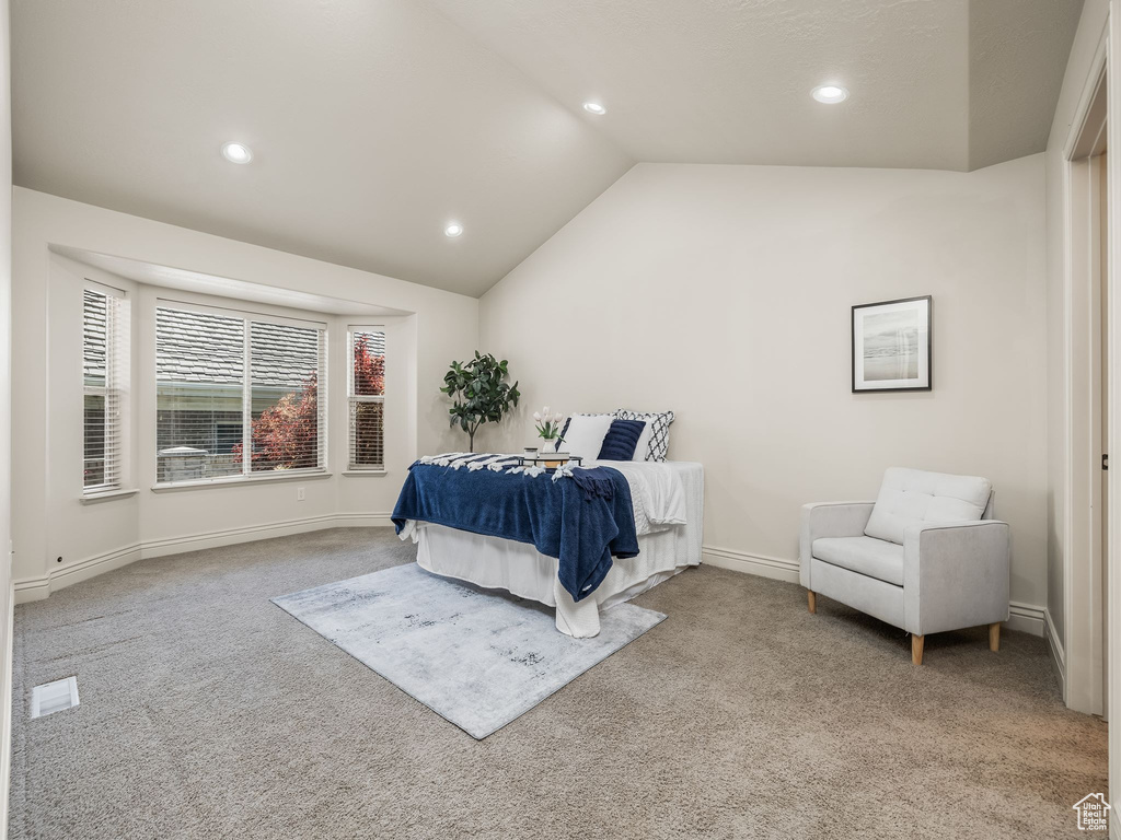 Bedroom featuring carpet floors, recessed lighting, and vaulted ceiling