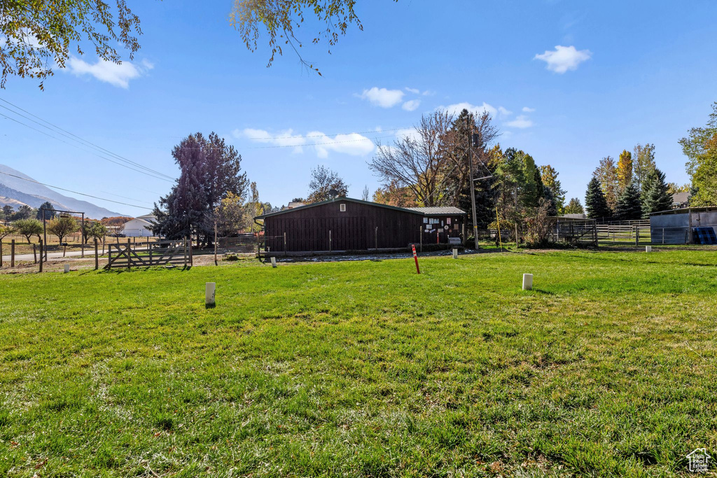 View of yard featuring an outbuilding and a mountain view