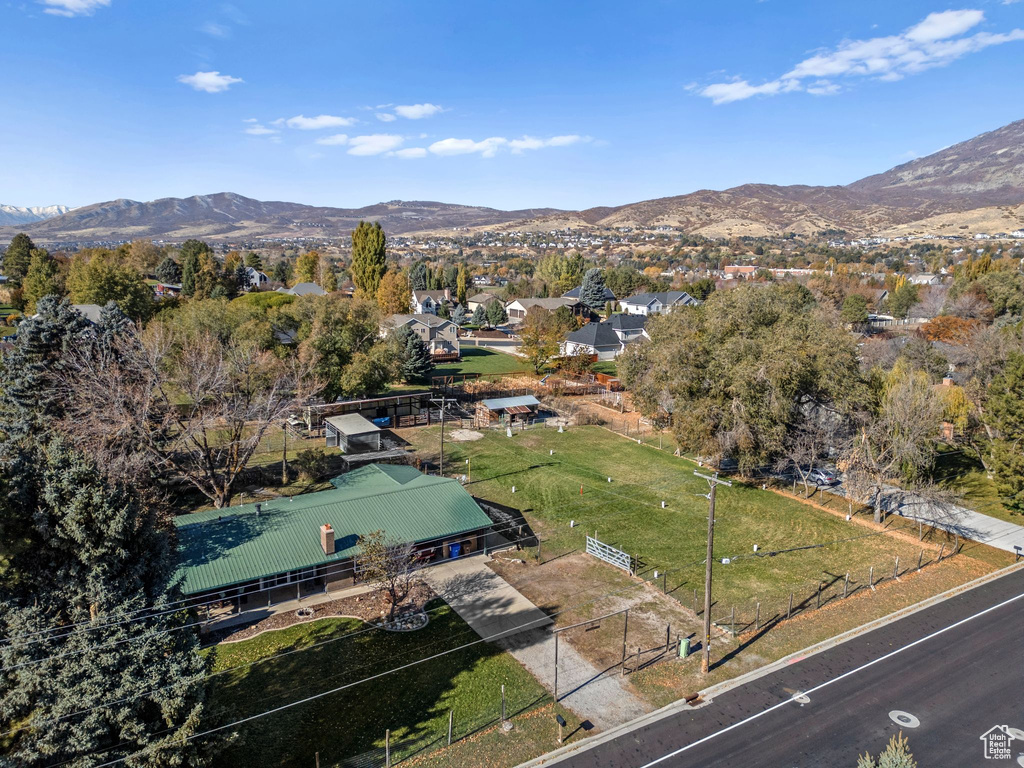 Aerial view of property and surrounding area featuring mountains
