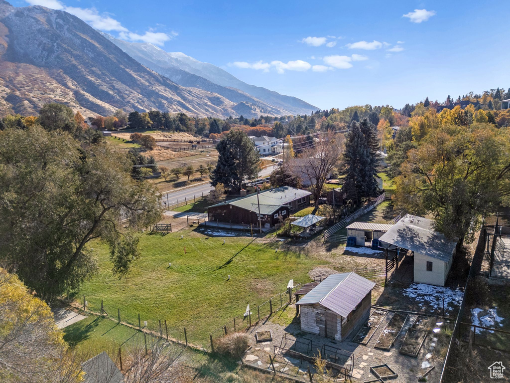 Aerial view of property and surrounding area with mountains