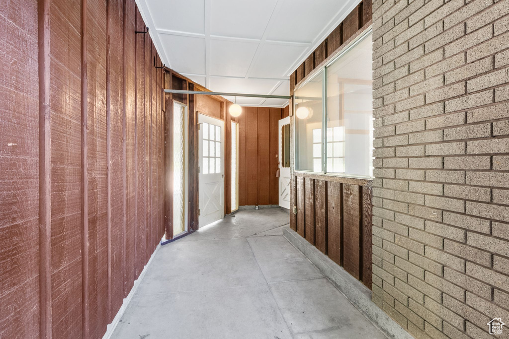 Hallway featuring concrete floors