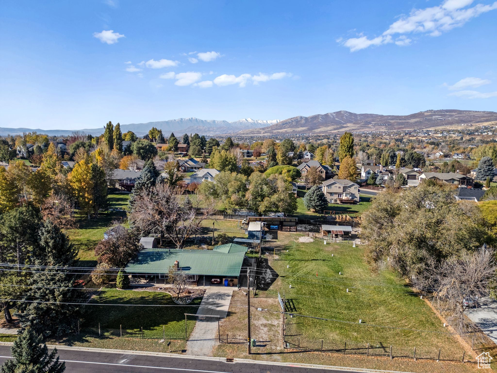 Aerial perspective of suburban area with a mountain backdrop
