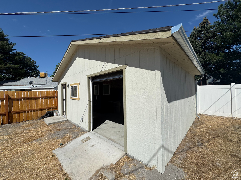 View of outdoor structure with a fenced backyard