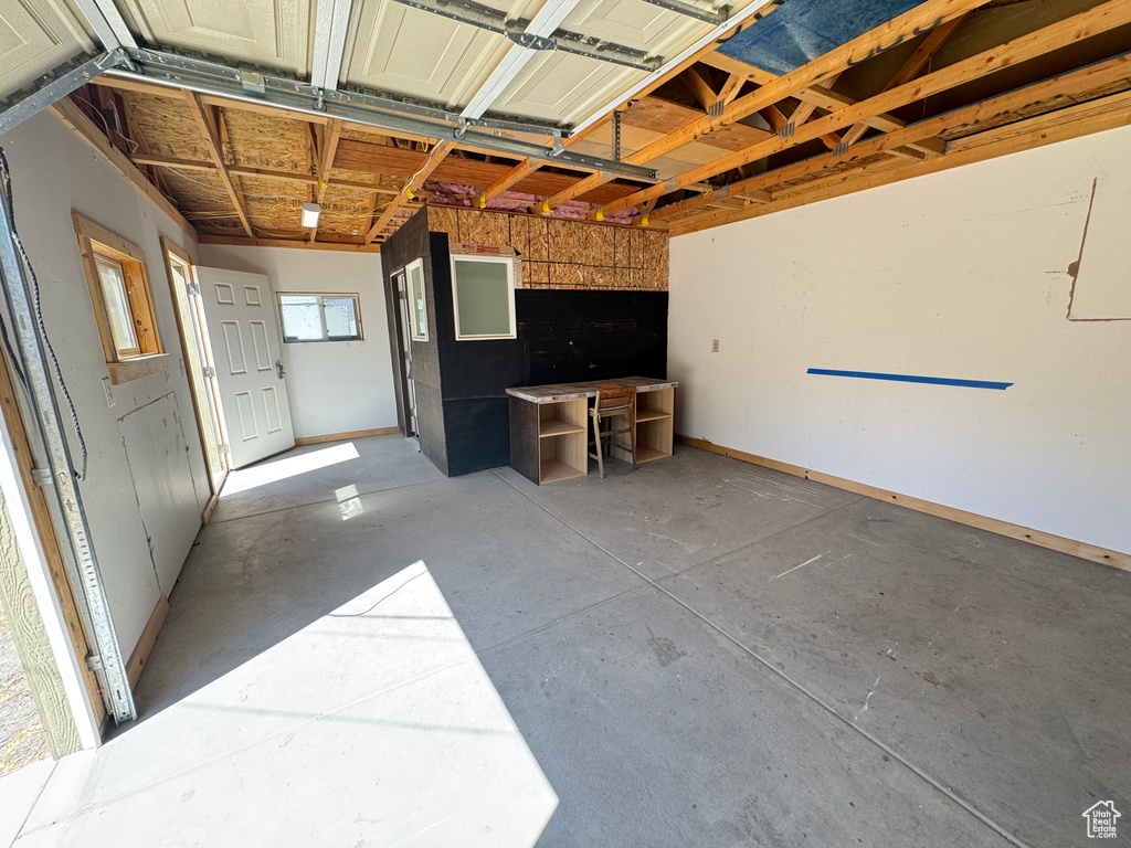Garage featuring baseboards