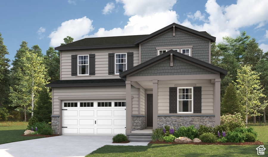Craftsman house featuring stone siding, a garage, concrete driveway, and a front yard