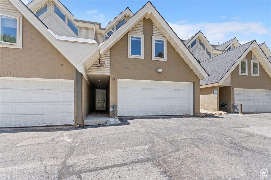 View of property featuring a garage