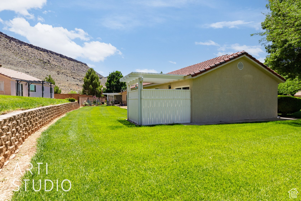 View of yard featuring a mountain view and a pergola
