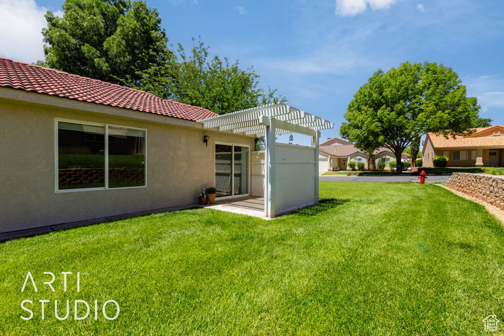 View of green lawn featuring a pergola