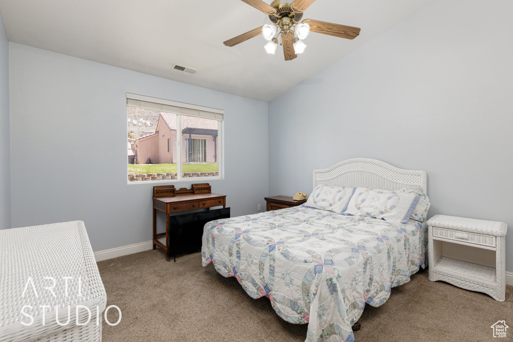 Bedroom featuring carpet floors, baseboards, a ceiling fan, and vaulted ceiling
