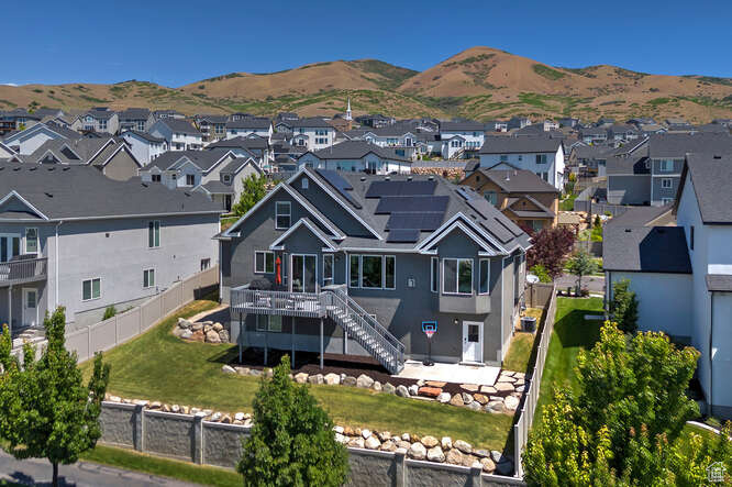 Aerial view of residential area featuring mountains