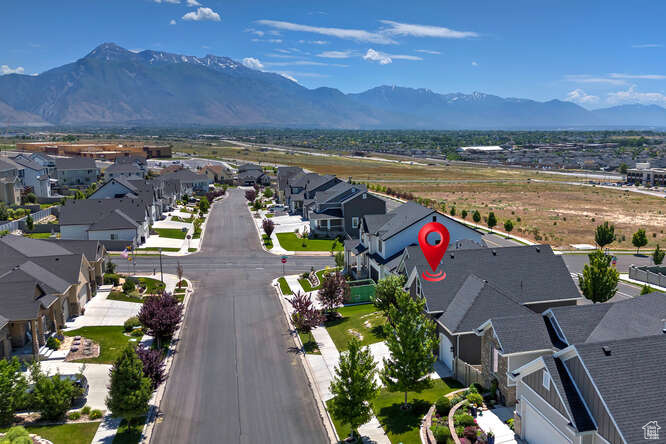 Aerial perspective of suburban area featuring a mountain backdrop