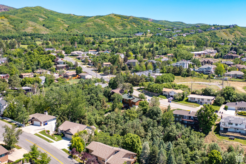 Aerial view of residential area with a mountainous background