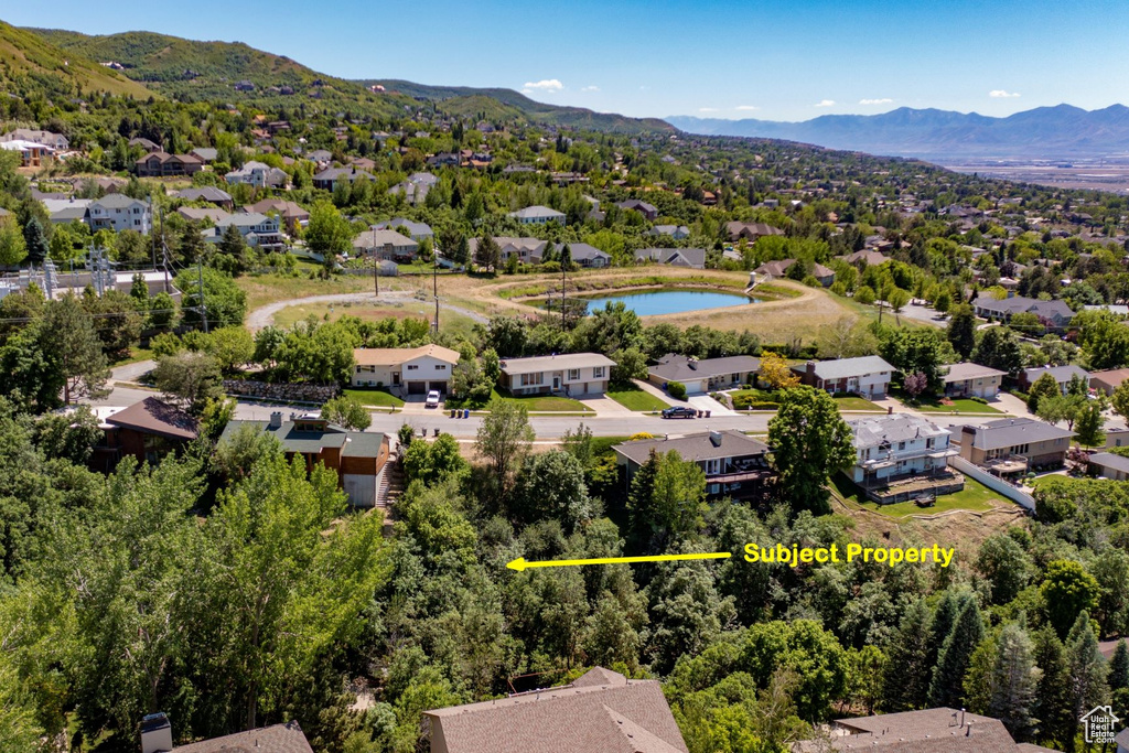 Aerial view of residential area with a mountain backdrop