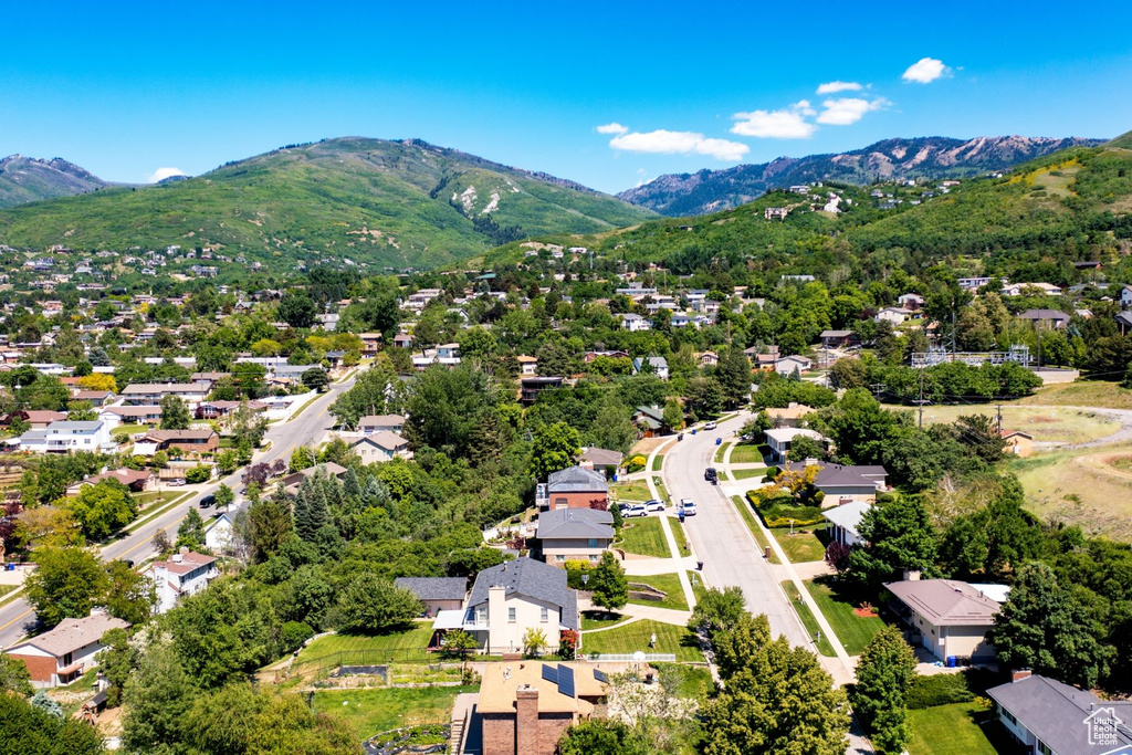 Aerial perspective of suburban area featuring a mountainous background