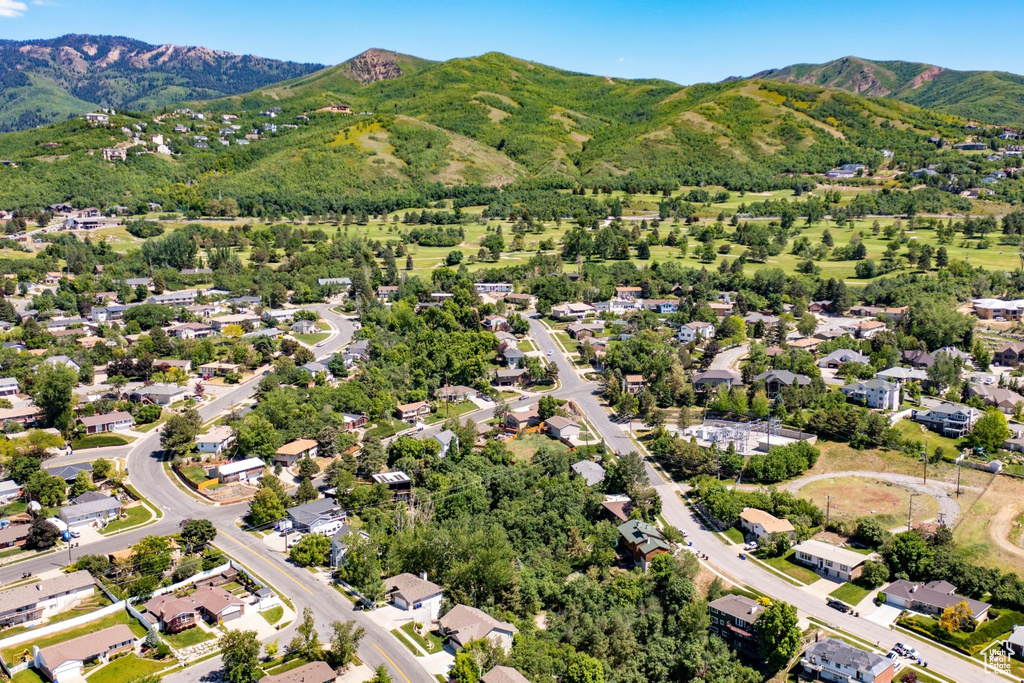 Aerial view of property\'s location with a mountainous background