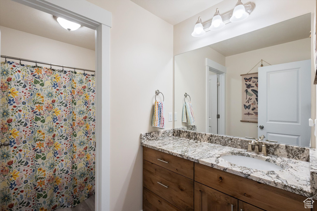 Bathroom with vanity and a shower with curtain