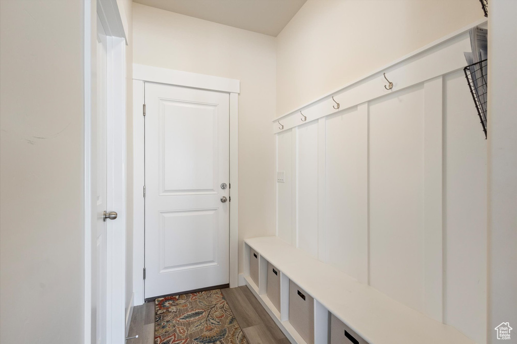Mudroom featuring dark wood-style flooring
