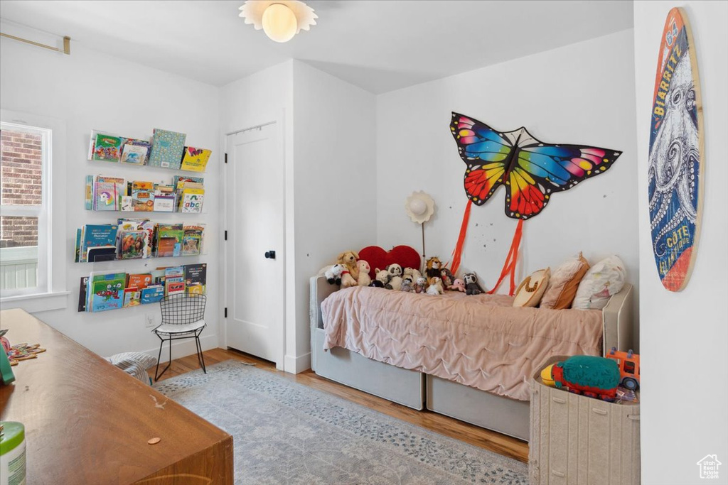 Bedroom with wood finished floors