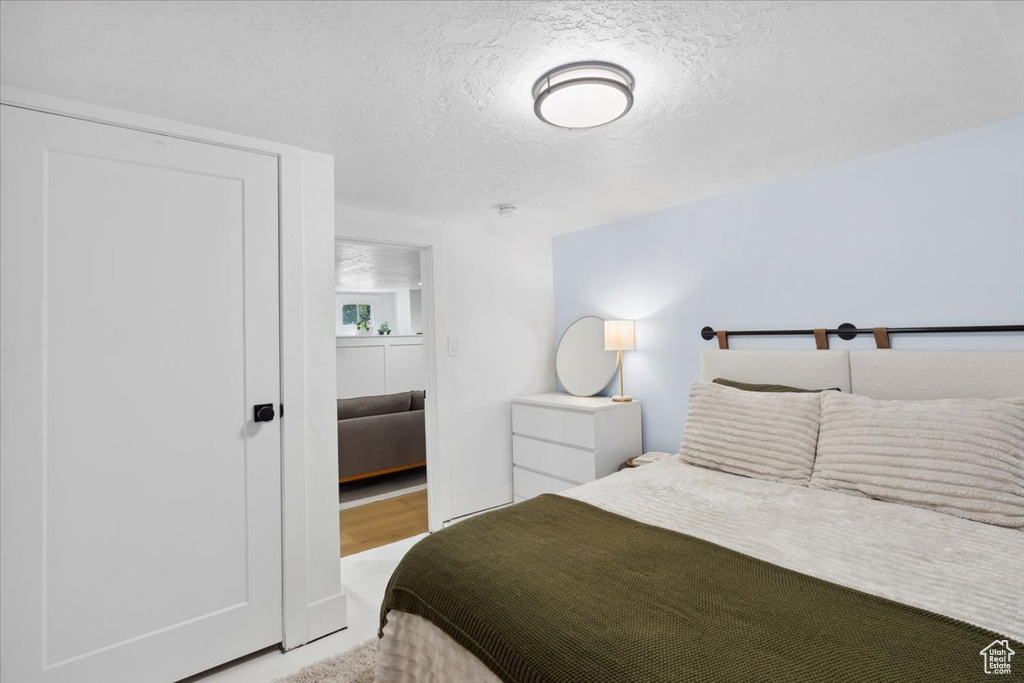Bedroom with a textured ceiling
