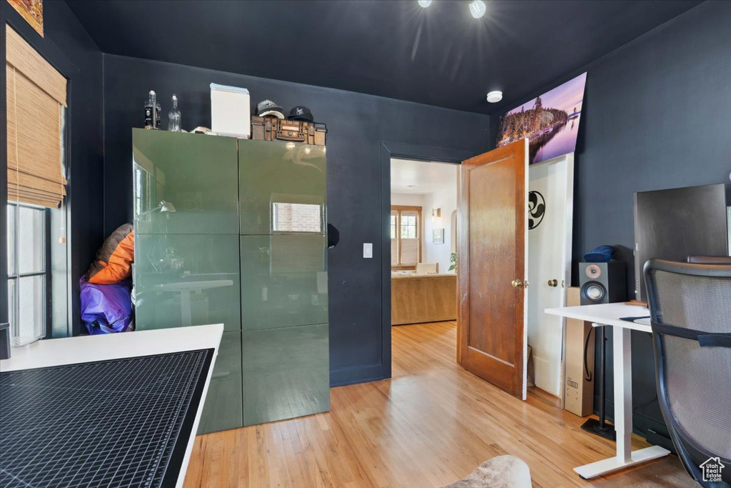 Home office with wood finished floors