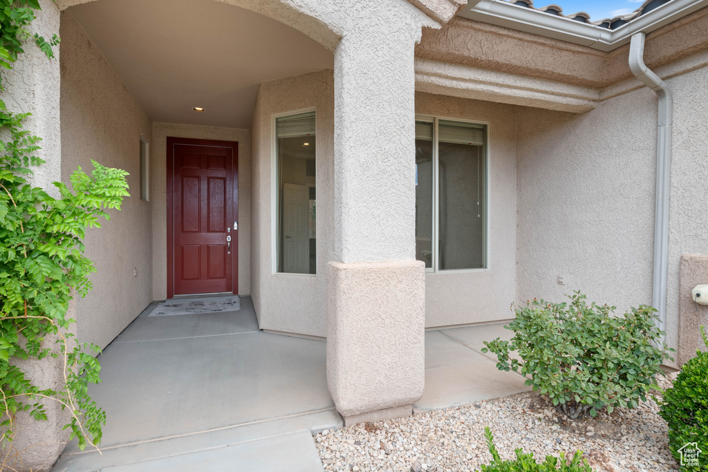 Entrance to property featuring stucco siding