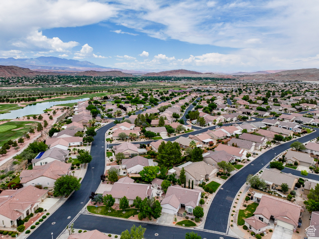 Aerial perspective of suburban area with a water and mountain view