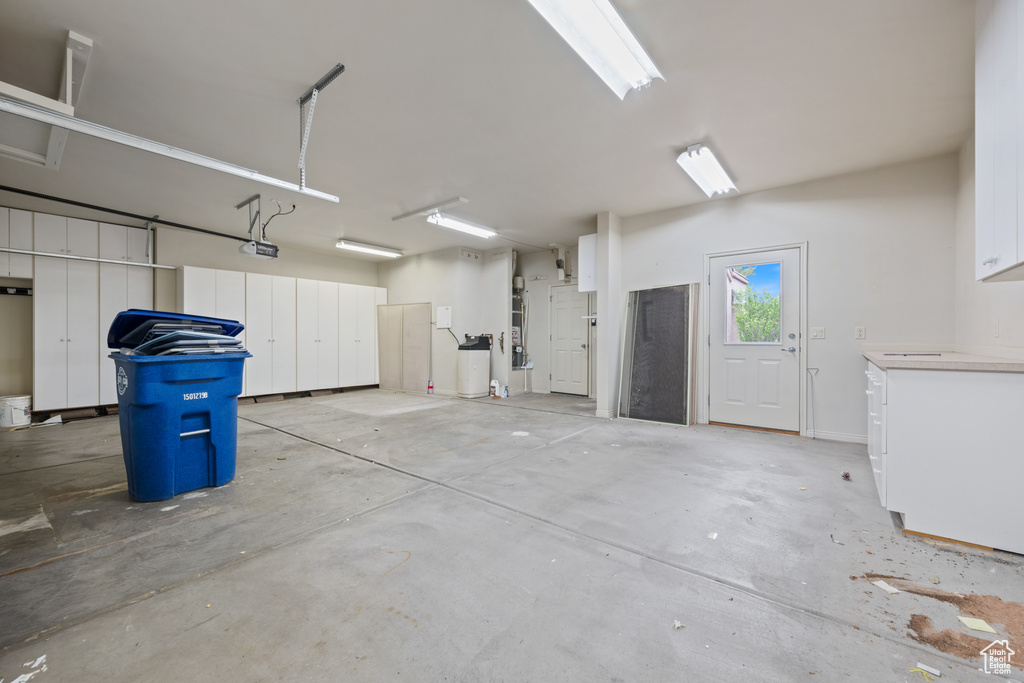 Garage featuring a garage door opener