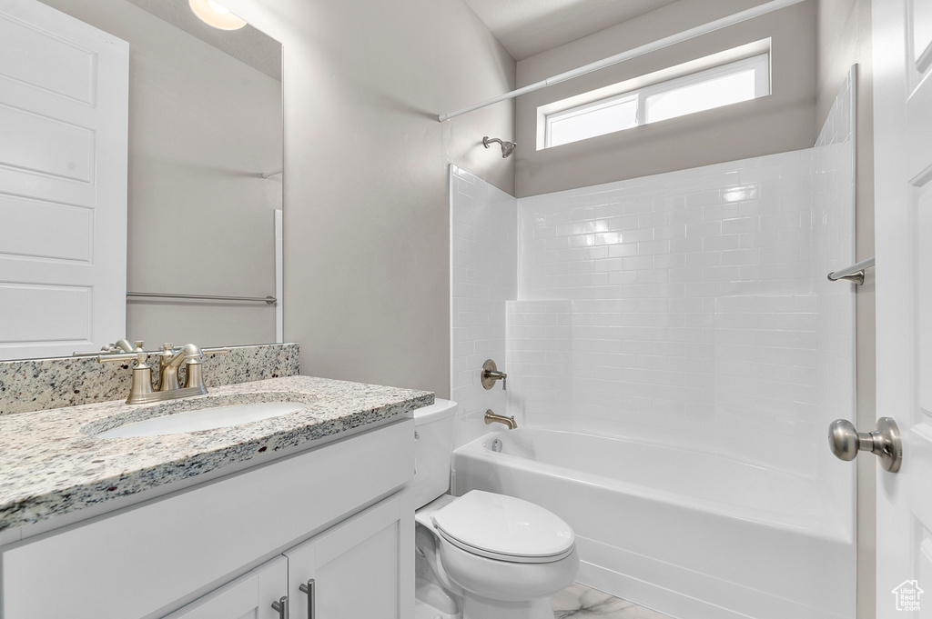 Bathroom featuring vanity and shower / bathtub combination